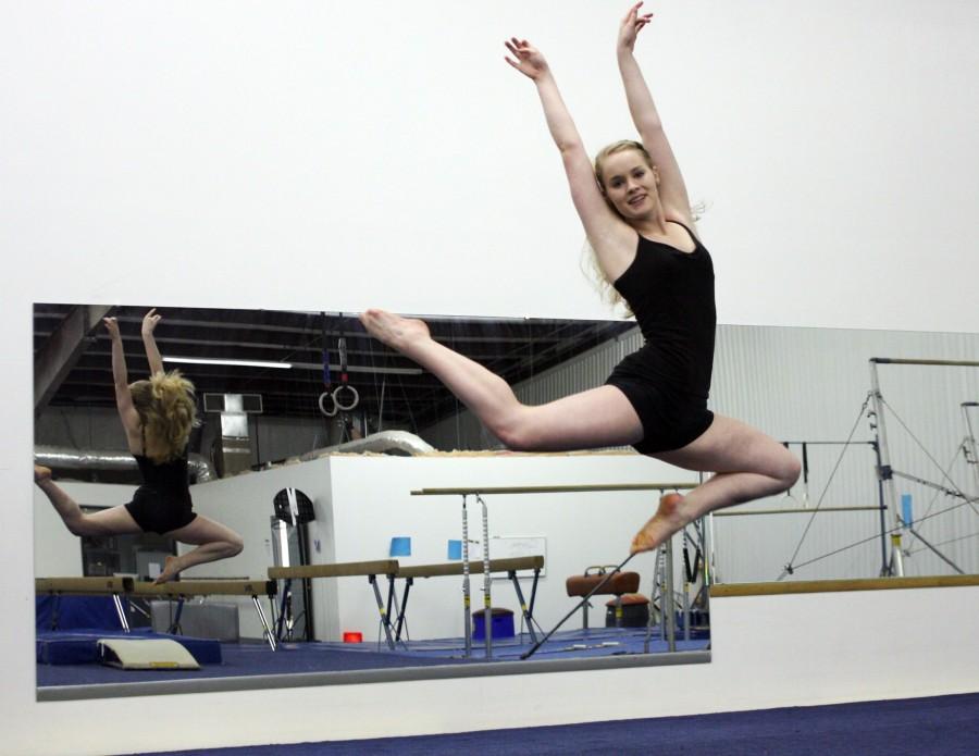 Senior Brittany Denman practices her stag leap. CAITLIN GREEN PHOTOS