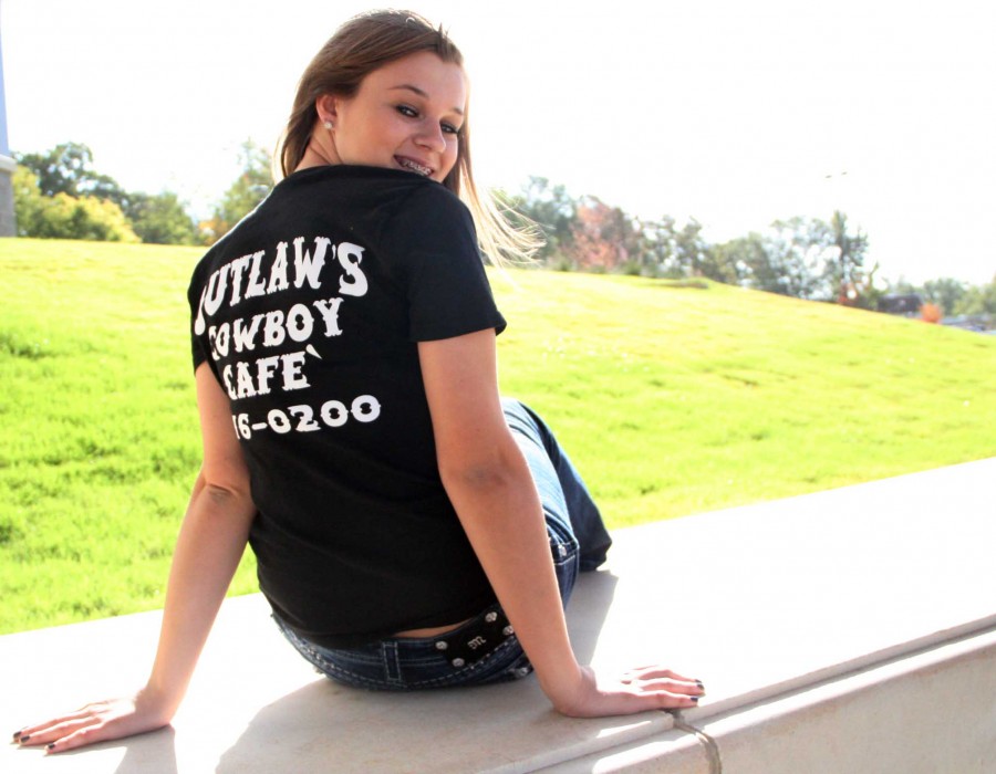 Sophomore Victoria Outlaw sporting her work shirt for her family business, Outlaws Cowboy Cafe / Lauren Sanders photo