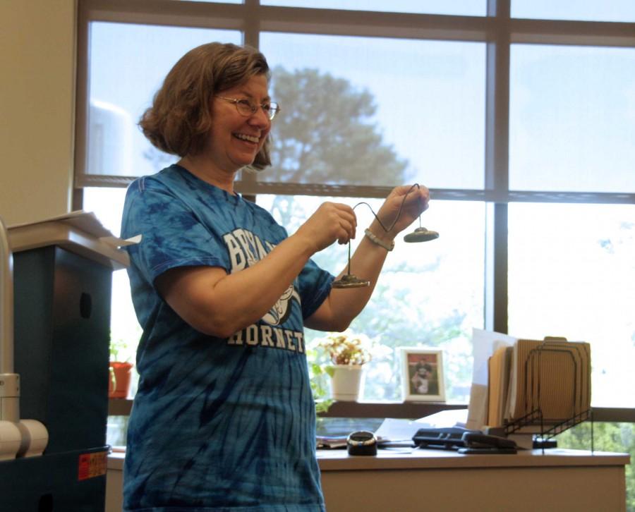 Doctor Andrea Sadler uses one of her special techniques, the bells, to help teach in her Algebra 3 class.