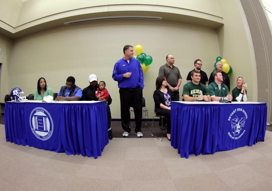 Tyree Reese, Tim Kelley and Ian Shuttleworth prepare to sign their letters of intent | ashley collins photo