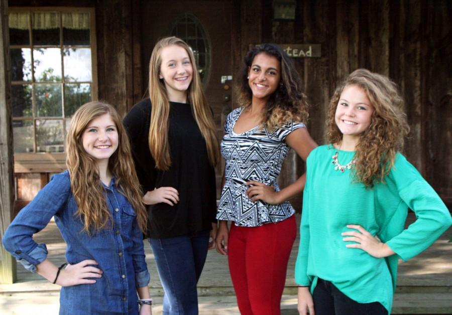In front of Farmstead, freshmen Erin Murphree, Kendal Rogers, Jadyn Lewis, and Natalie Pierce pose with smiles on their faces. | photo Emma Barnes