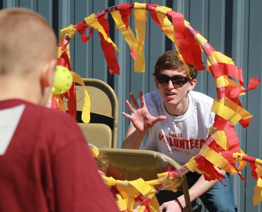 Junior Max Sullivan catches a ball while working the Ring of Fire booth during the Special Olympics. | photo Kenzi Brenton