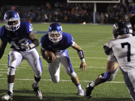 Brandan Warner tries to inch his way into the end zone | photo Chris Lewis