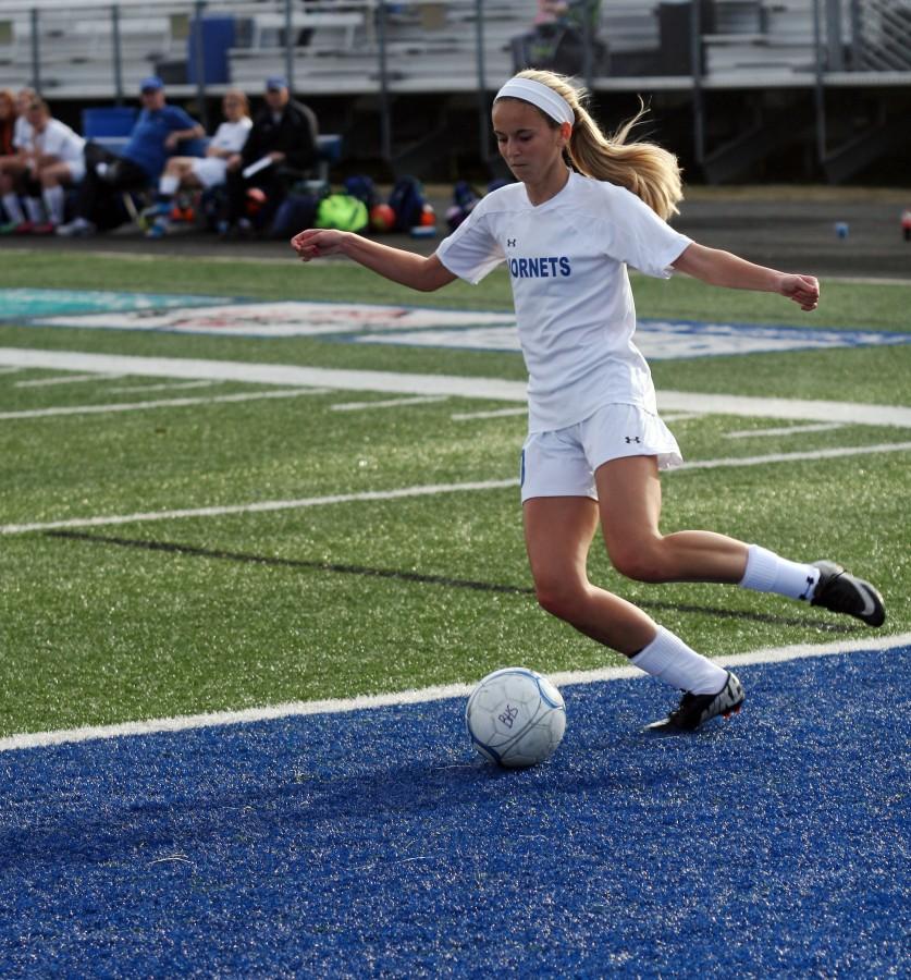 Junior Anna Lowery passes the ball to a teammate | photo Jake Atwood