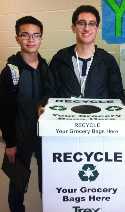 EAST students Oliver Sitepu and James Parada helping the YEA maintain recycling boxes. The YEA team has recently put recycling bins across campus in an effort to reduce pollution. Photo courtesy of Kori Kordsmeier.