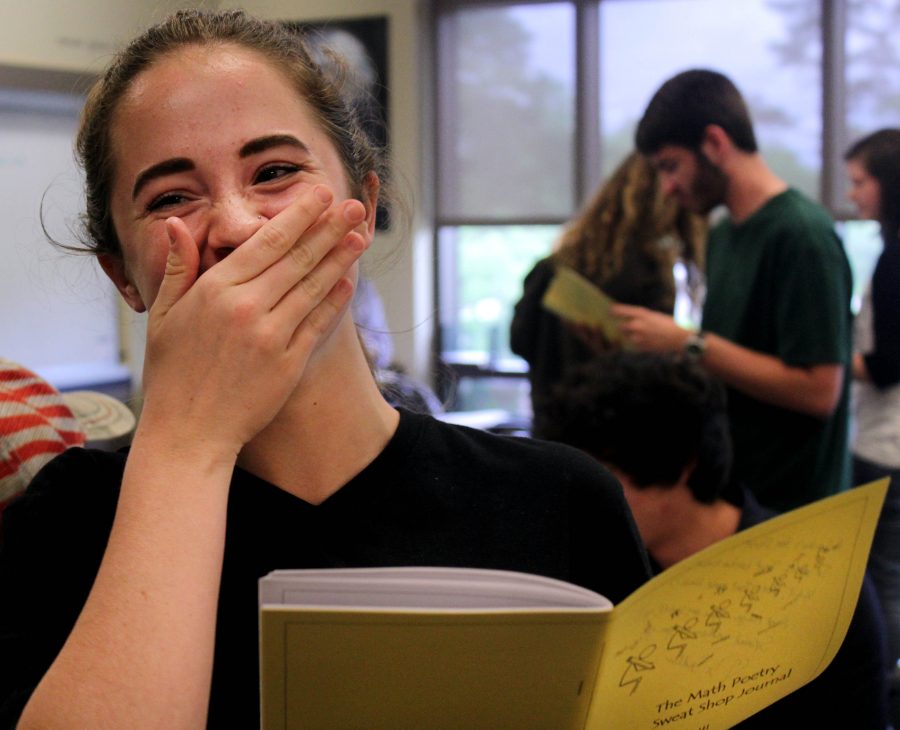Junior Sarah Sellers giggles at a poem during the first lunch launch party. Sellers had a few of her poems published in the journal and received an honorable mention award.