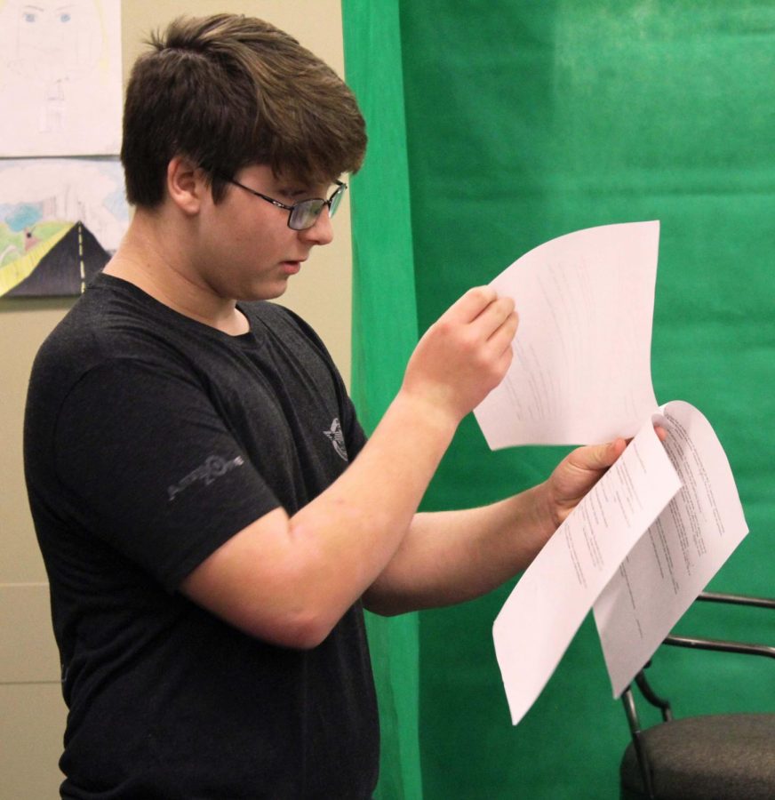 Flipping through the script, freshman Jacob Atherley prepares to act in the first scene. He played the main character, Steven. “I’ve always liked playing a nice part,” Atherley said. “I thought it would be fun.” 