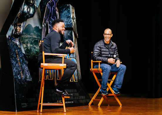 “Black Panther” director Ryan Coogler, left, and executive producer Nate Moore speak with audience members during a Q&A session at the theater on Joint Base Andrews, Md., Feb. 11, 2018. The duo facilitated a free military appreciation showing after the Q&A session as a way to give back to service members and their families. (U.S. Air Force photo by Senior Airman Delano Scott) (Photo by Senior Airman Delano Scott)