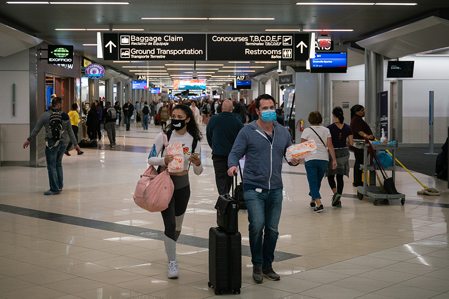 Flyers at Hartsfield-Jackson Atlanta International Airport wearing facemasks on March 6th, 2020 as the COVID-19 coronavirus spreads throughout the United States.