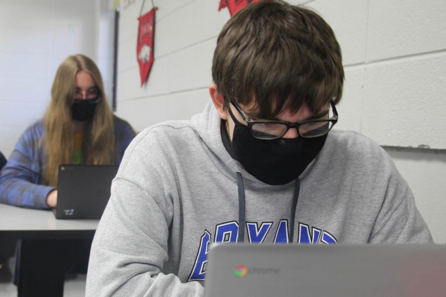 In English 12, 
senior Zachery Kutchfar works on assignments using a school-issued Chromebook.