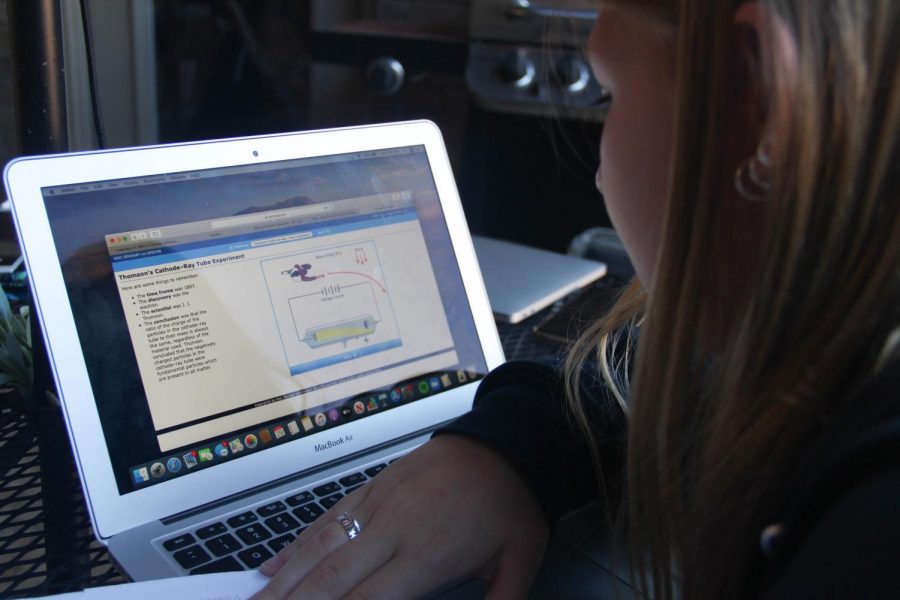 Zooming, junior Brooklyn Dunn works on an assignment for her 6th period integrated Pre-AP chemistry class. Dunn chose virtual learning for this school year. 