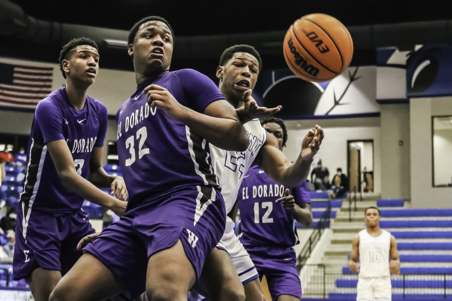 During the home game against El Dorado Dec. 18, senior Gavin Brunson tries to recover the ball. The Hornets defeated the Wildcats on their senior night. 