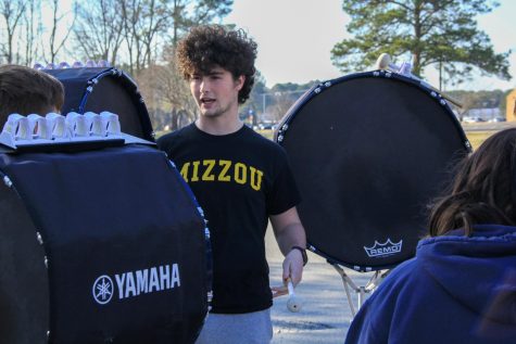 Senior Sam Davenport instructs other percussionists during sectional practices.