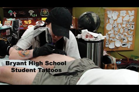 Senior Nick Skiavo getting a tattoo from Bryant alumni Sidney Shipe