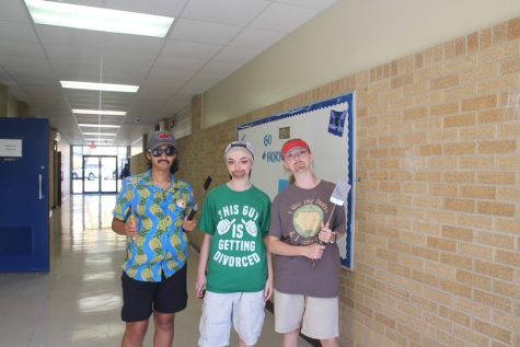 Sophomores Adalynn Mellon, Gabriella Webb, and Sydney Pomtree wear their outfits for “Adam Sandler Wednesday” during Bryant High School’s spirit week. 