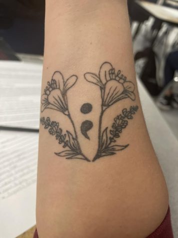 Senior Rory Martins semicolon tattoo.