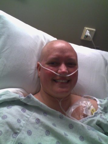 Amanda Black, the school facilitator, taking a selfie after doing treatment. She shaved her head beforehand, which was the last time she has ever cut her hair.