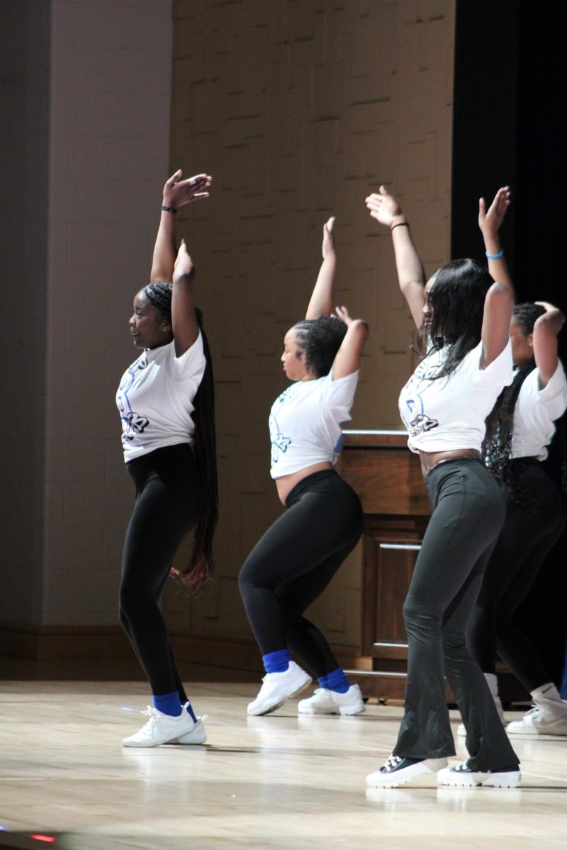 The pep club, a newly formed club run by Jones with a goal to hype up the student body, performs during the assembly. The pep club students created their routine. 