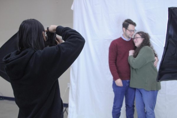 Lily Presley takes photos of AP Literature teacher Melanie Angell and her husband.