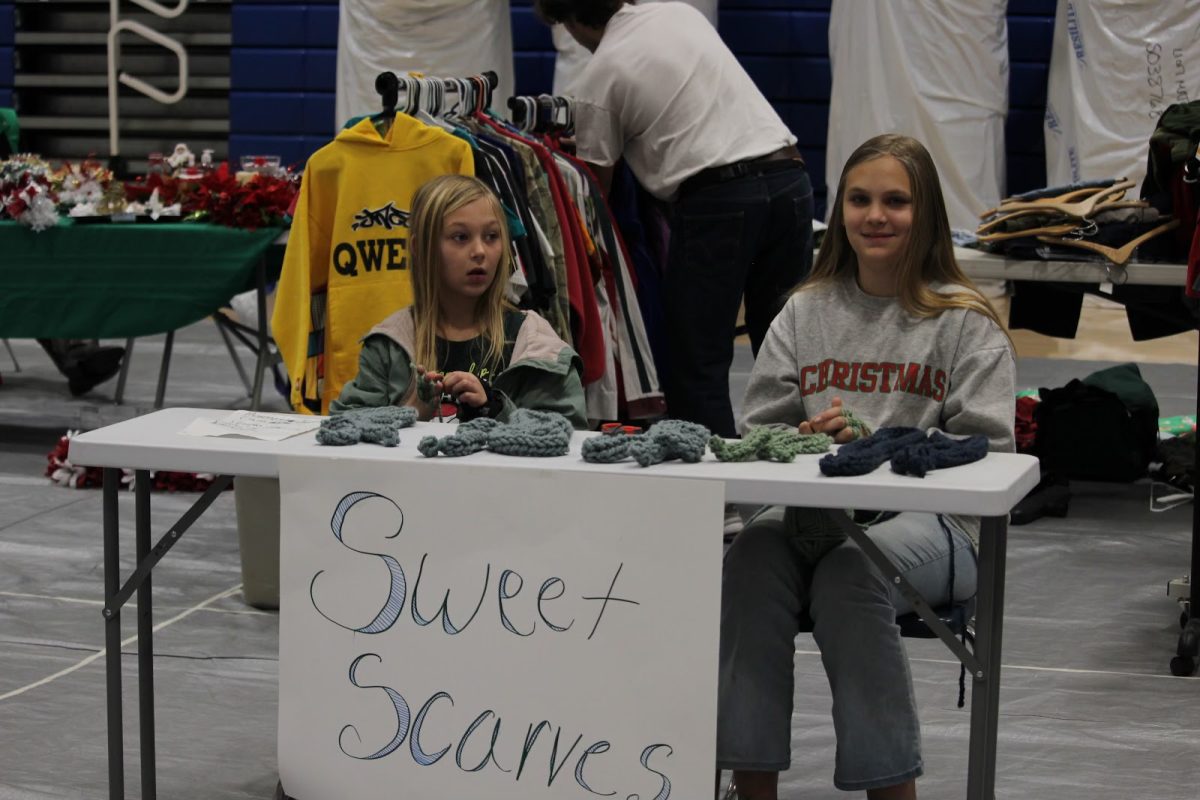 Olivia Foster, a student at Bethel Middle school, and Abby Foster, a student at Collegeville Elementary School, sell homemade scarves at their booth on the gym floor. They sold scarves with their mother at the market, and made the scarves themselves prior to the event.
“This is really fun,” Foster said. “I’ve never done something like this before.” 