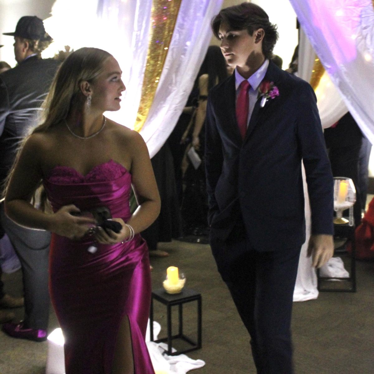 Attendees enter the 2025 Great Gatsby Prom at the Benton Event Center in unique dresses and suits on the evening of April 26. 