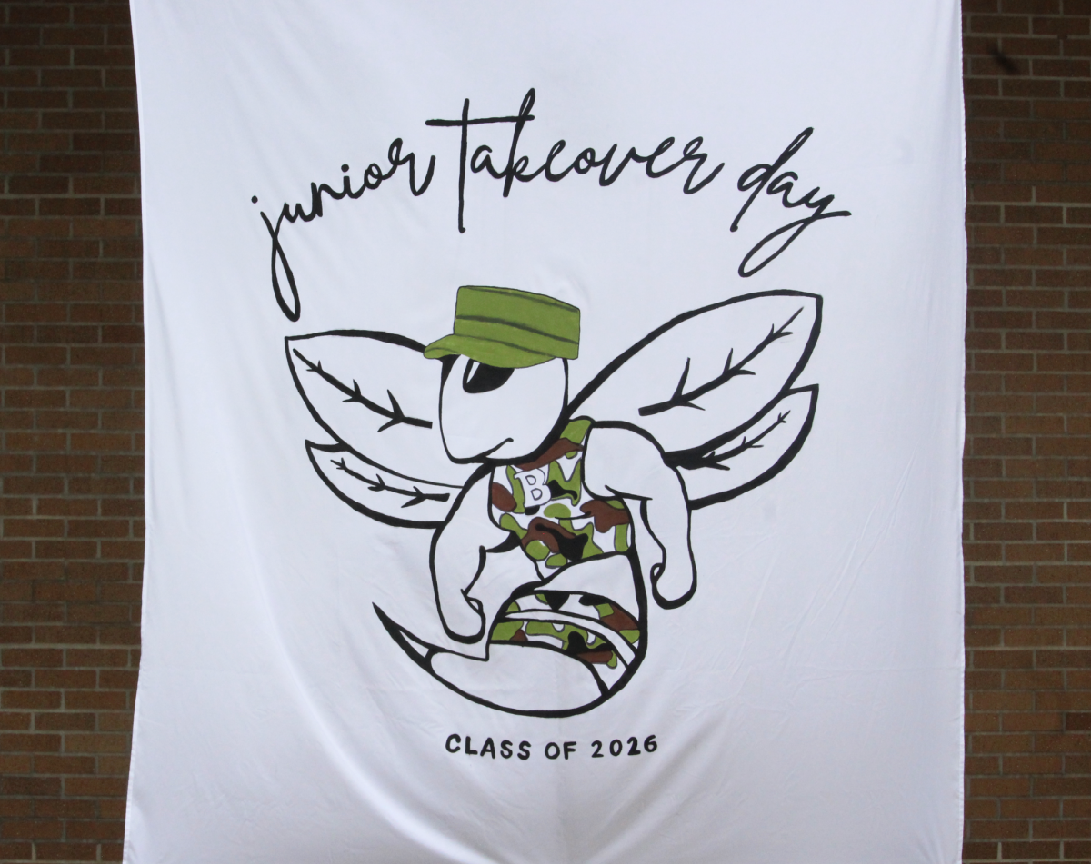 Hand-painted banner displayed outside Building 9 for Junior Takeover Day.