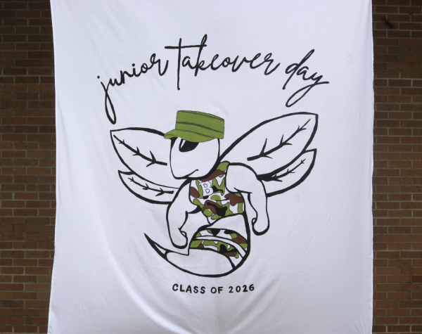 Hand-painted banner displayed outside Building 9 for Junior Takeover Day.