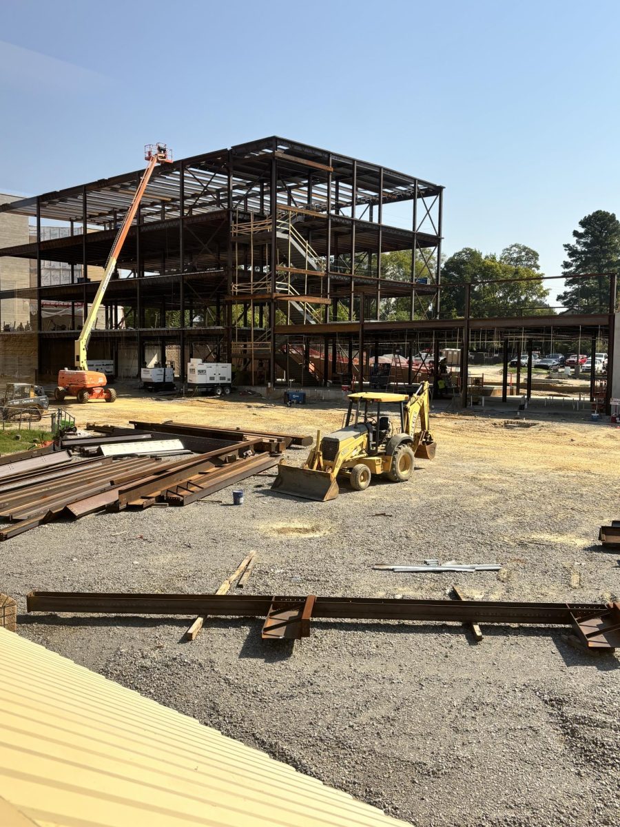 Baldwin & Shell construction company continue to work Thursday, Sept. 15, while all the students are attending the pep rally. This was taken directly beside building 3, a science building that has been in use at BHS since 1975. It is one of the buildings that will be demolished in the construction. 