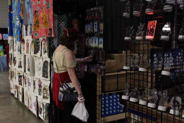 Junior Erin Wright viewing merchandise while attending the Comic Con convention on Sept. 12